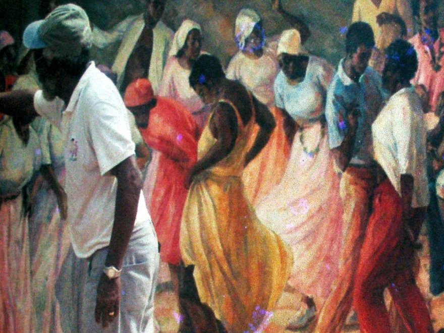 A male artist works at a large oil painting