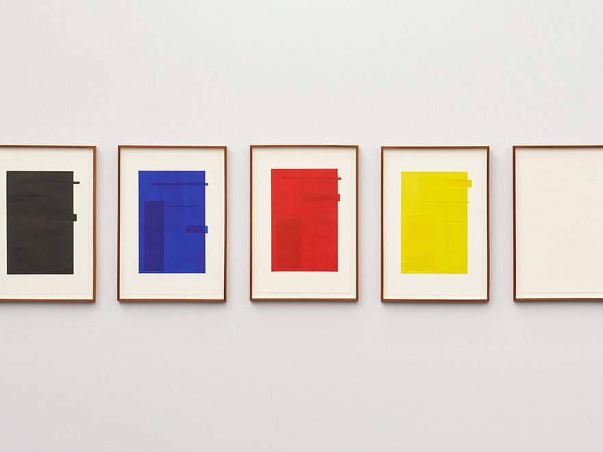 5 rectangular framed pictures with different coloured blocks of primary colours in each