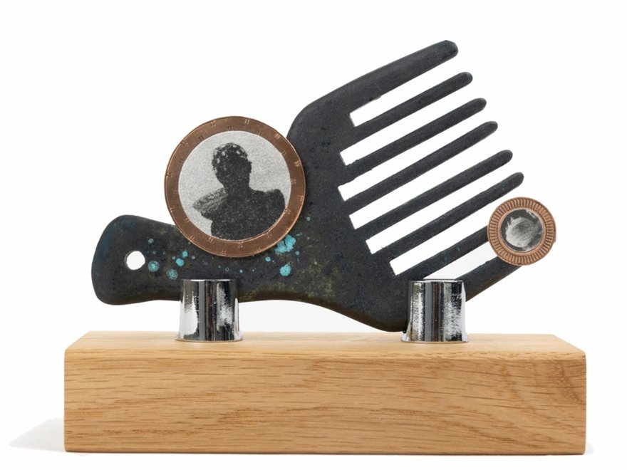 A sculpture with a comb