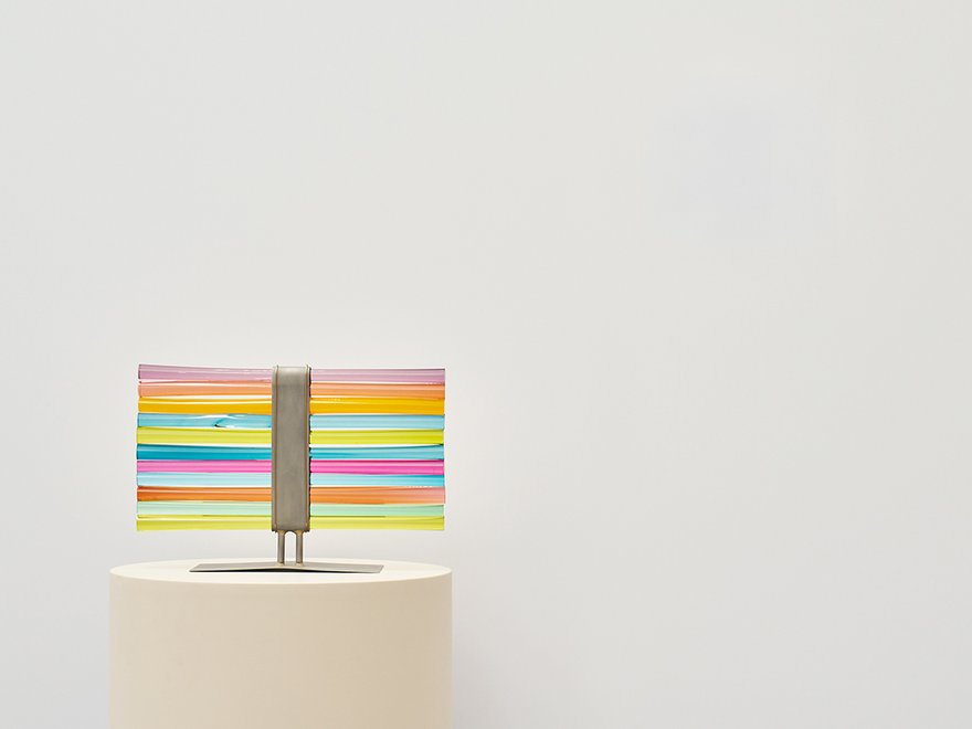 Metal sculpture with horizontal stripes of colour