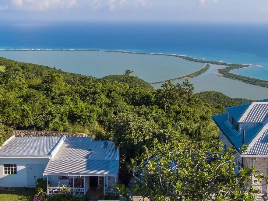 View of the ocean with houses in the foreground