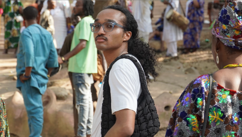 A young man captured on a busy street